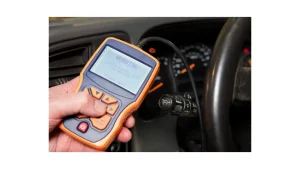 An OBD-2 scanner being used on a car