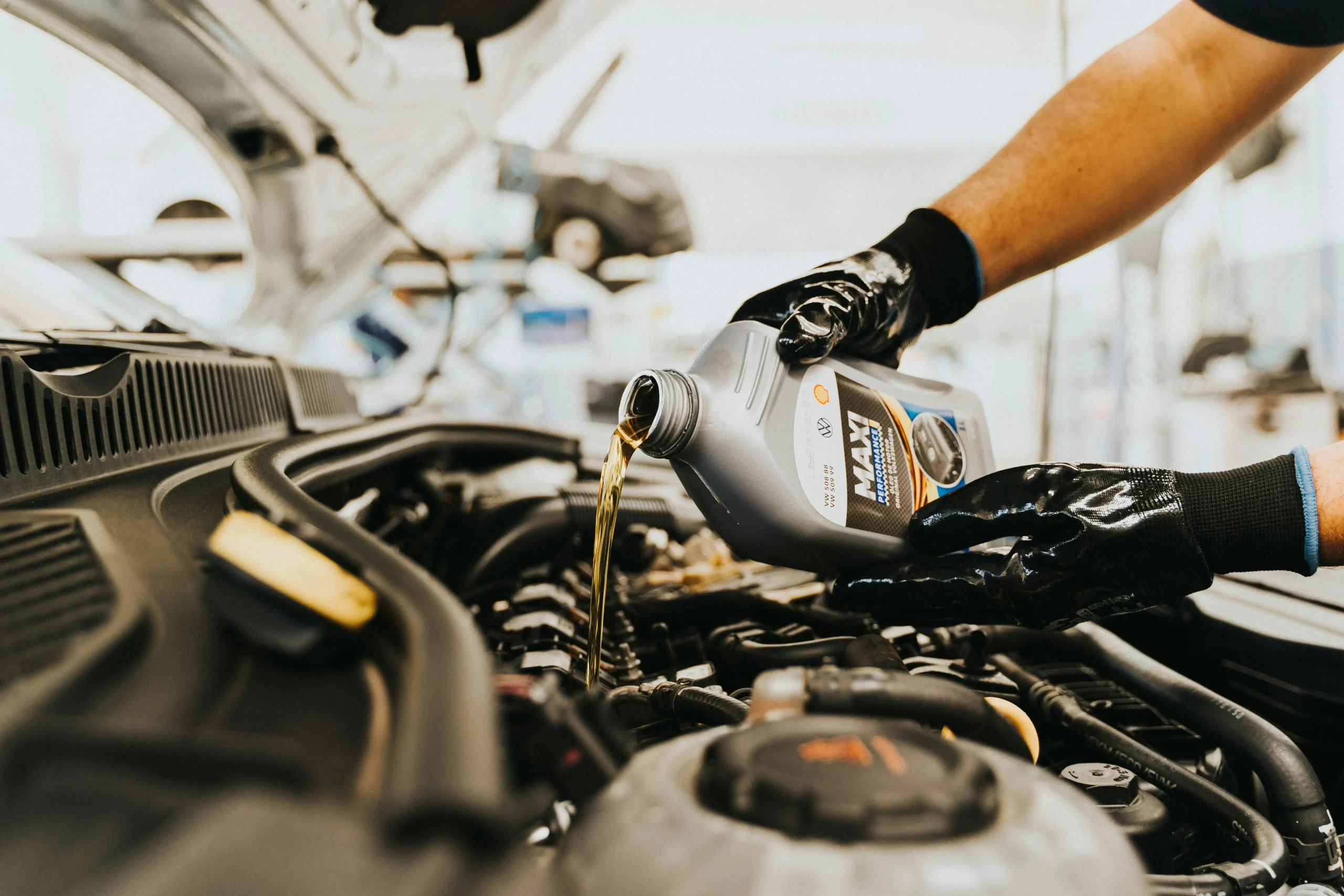 Person changing car oil