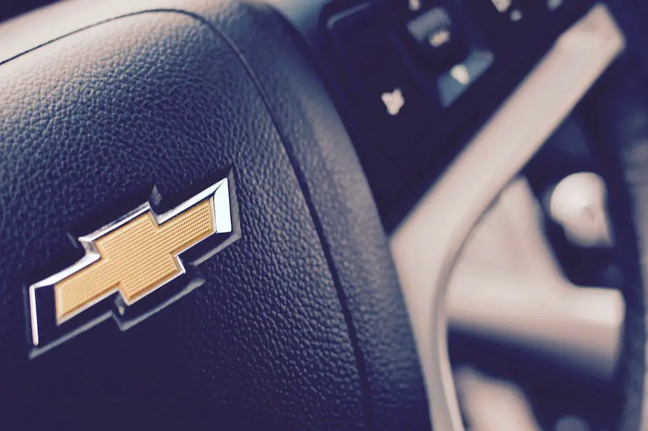 Descriptive image of a person using an OBD-II scanner on a Chevy Silverado to troubleshoot the P0700 code.