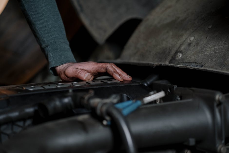 Image of a car being examined by a mechanic, representing the P0299 code troubleshooting