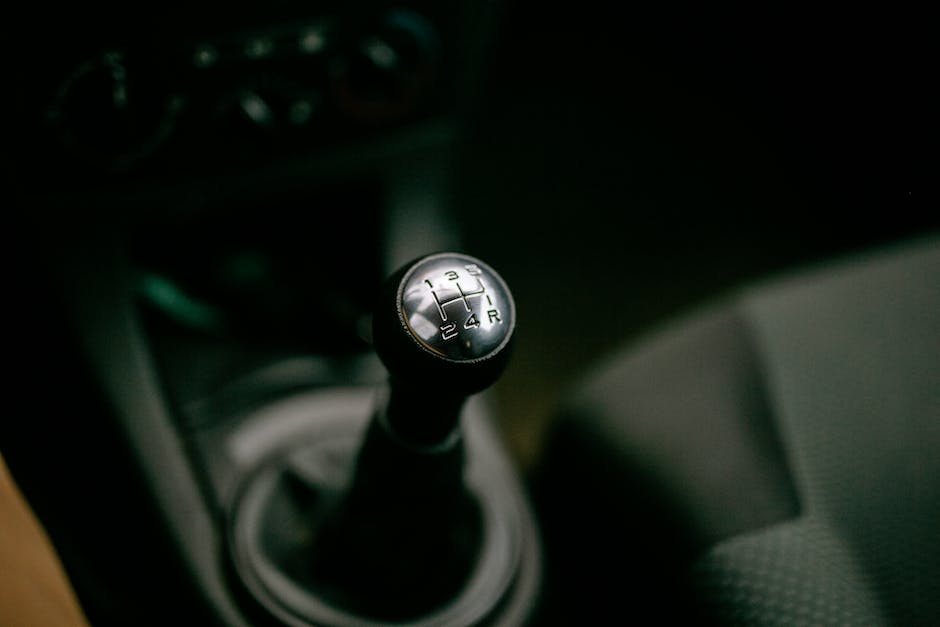 An image showing a car gear shifter with highlighted 'park' position.