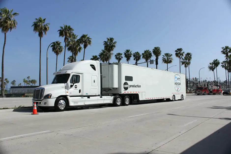 A silverado-1500 truck on the road with a trailer attached